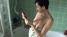 Kim's boobs slip out of her towel